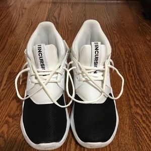 White and Black Nike shoes